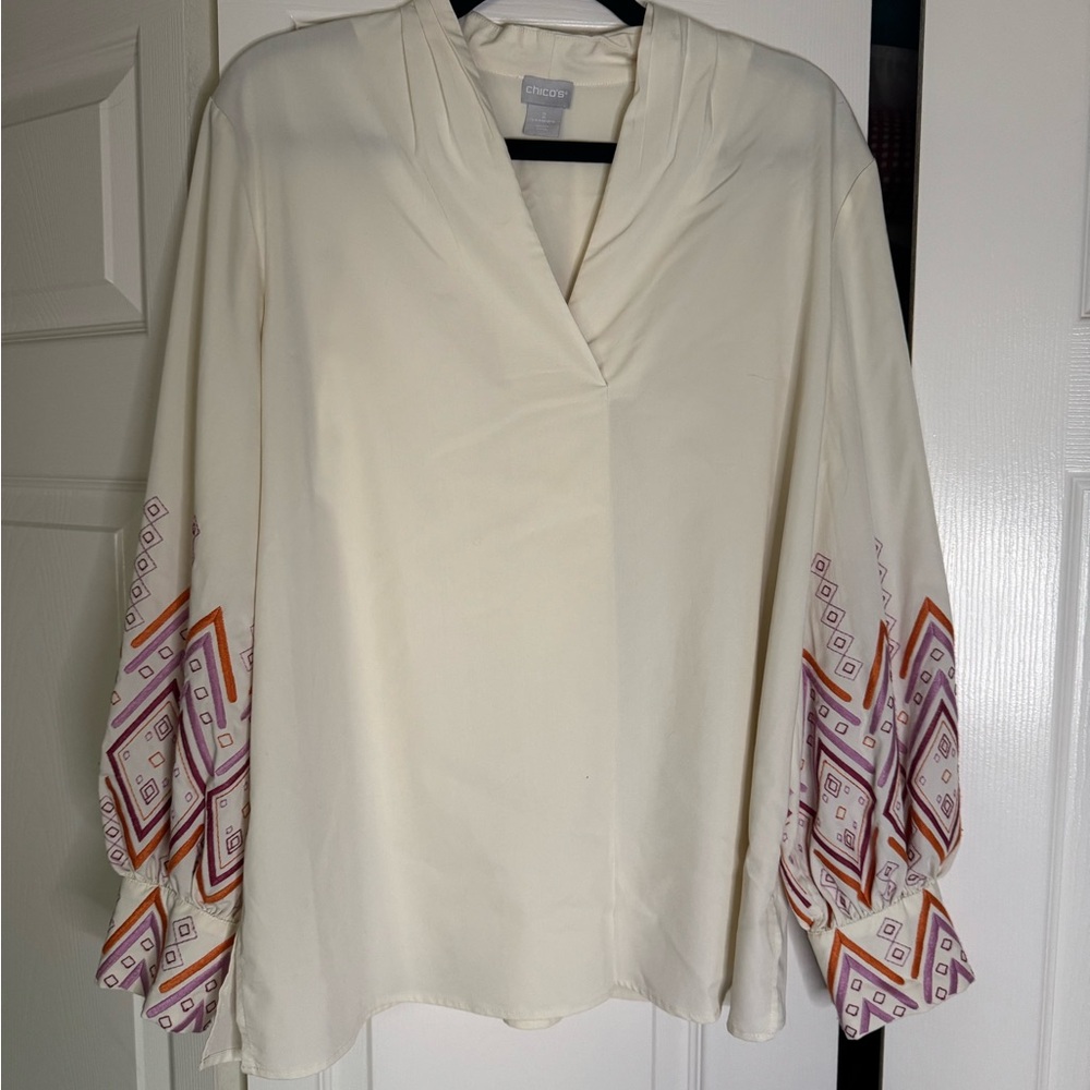 Cream long sleeve top with pink and orange accents
